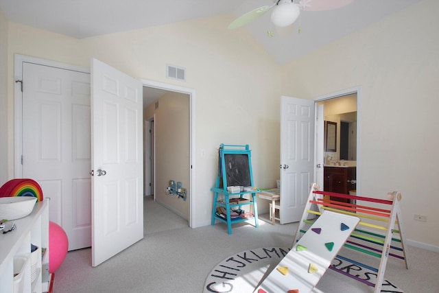 recreation room with visible vents, lofted ceiling, a ceiling fan, carpet floors, and baseboards