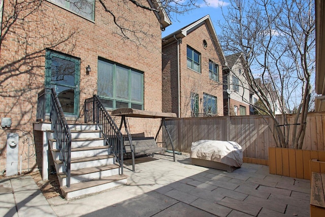 view of patio / terrace with grilling area and fence