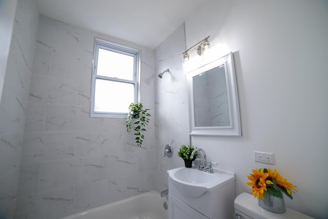 bathroom with shower / bathing tub combination, vanity, and toilet