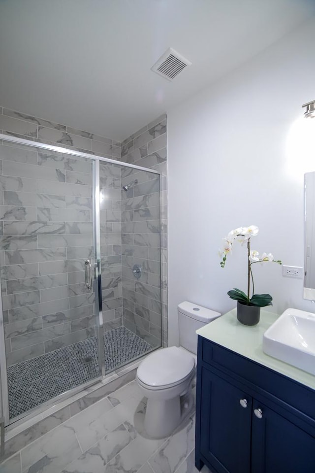 full bathroom featuring marble finish floor, visible vents, vanity, and toilet