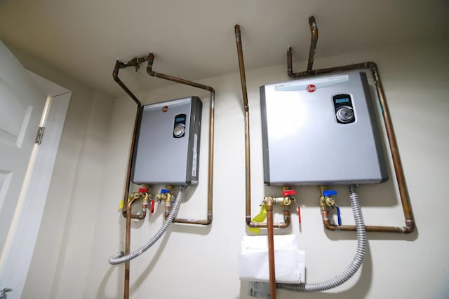 utility room with tankless water heater