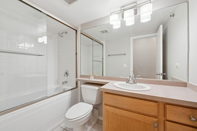 full bathroom with bath / shower combo with glass door, vanity, and toilet