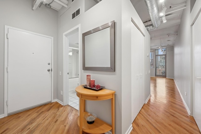 hall featuring light wood-type flooring