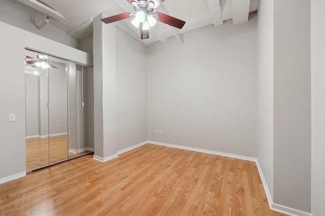 unfurnished bedroom featuring light wood-type flooring, a closet, and ceiling fan