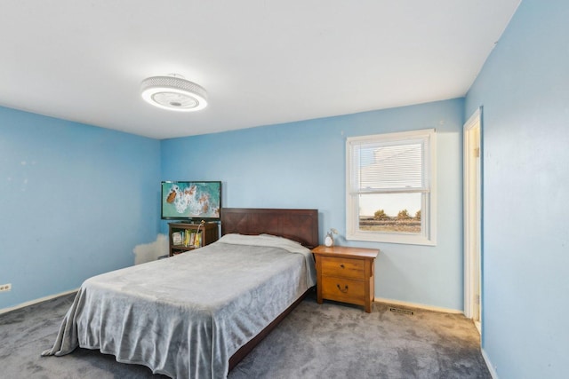 bedroom with carpet floors and baseboards