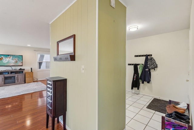 hallway with tile patterned floors