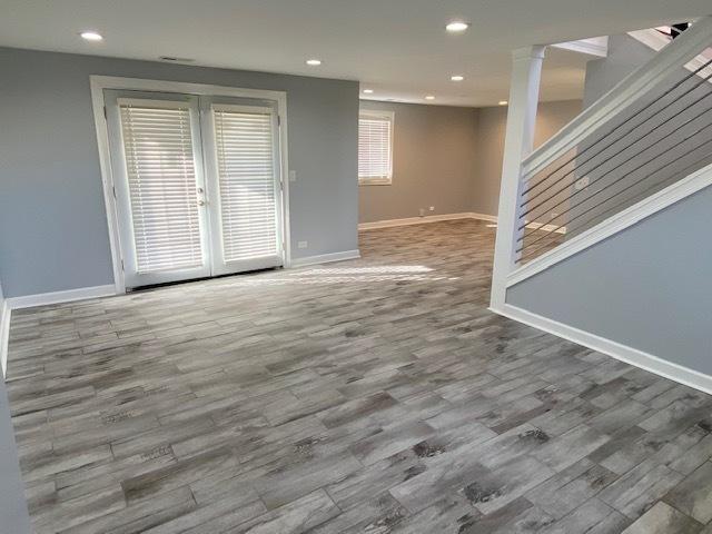 unfurnished living room featuring hardwood / wood-style flooring