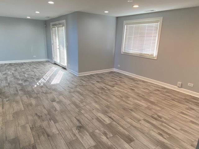 empty room featuring hardwood / wood-style flooring