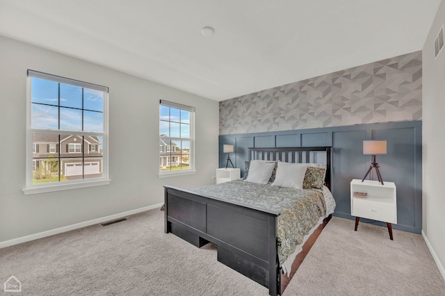 bedroom with light colored carpet