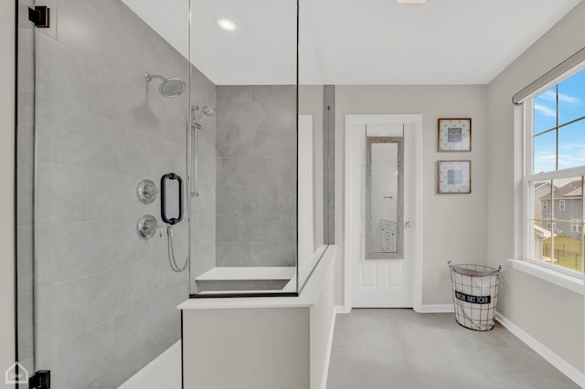 bathroom with a shower with shower door