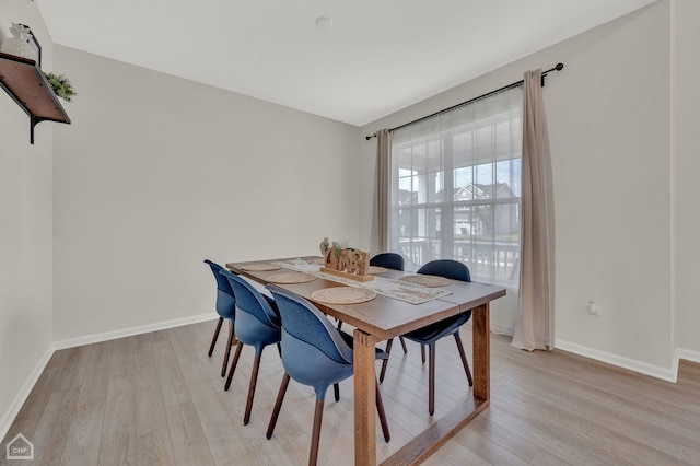 dining space featuring light hardwood / wood-style flooring