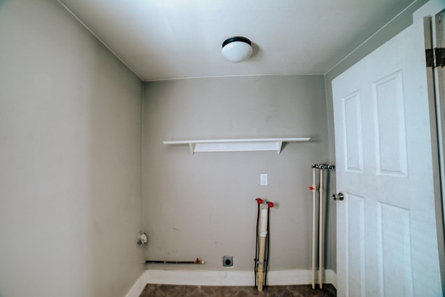 laundry area with hookup for a washing machine, laundry area, and baseboards