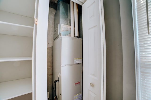 utility room with gas water heater