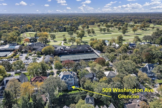 aerial view with golf course view and a residential view