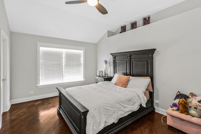 bedroom with lofted ceiling, dark wood-type flooring, a ceiling fan, and baseboards