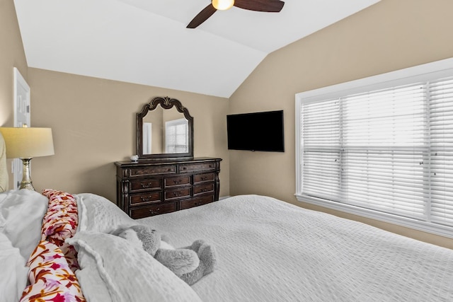 bedroom with lofted ceiling and a ceiling fan