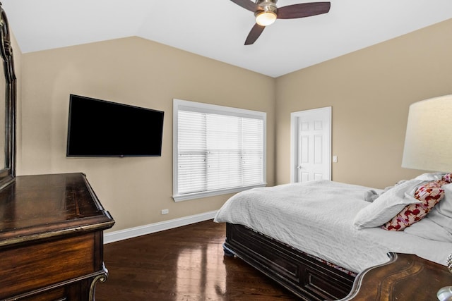 bedroom featuring dark wood-type flooring, lofted ceiling, ceiling fan, and baseboards