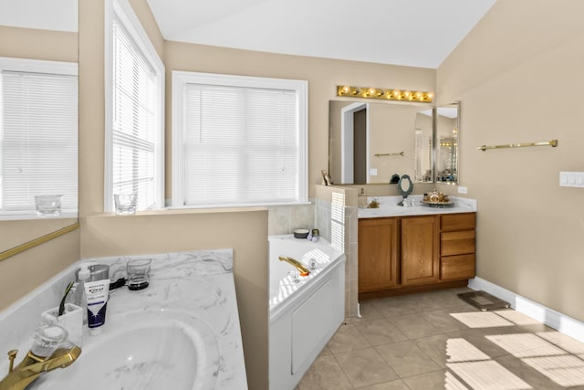 bathroom featuring lofted ceiling, two vanities, a sink, a bath, and tile patterned floors