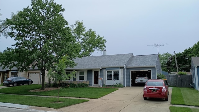 view of front of home featuring concrete driveway, a front lawn, roof with shingles, and an attached garage