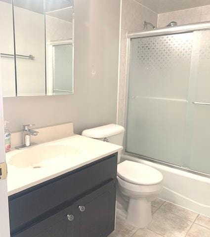 spare room featuring dark tile patterned floors and dark carpet