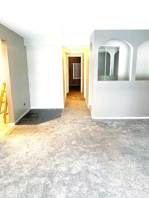 interior space featuring baseboards