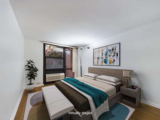 bedroom with dark hardwood / wood-style flooring