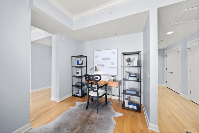 office with crown molding, wood finished floors, visible vents, and baseboards