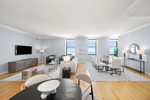 dining area featuring light wood-style floors and plenty of natural light