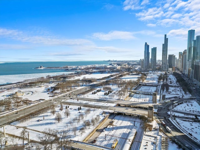 bird's eye view featuring a water view and a city view