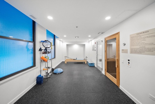 workout area with recessed lighting, visible vents, and baseboards