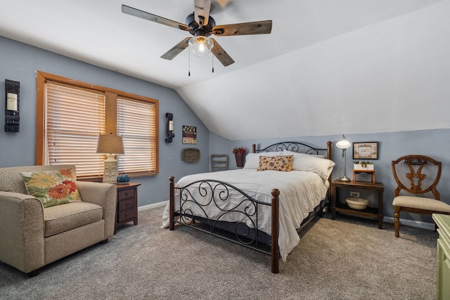 bedroom with carpet floors, baseboards, vaulted ceiling, and a ceiling fan