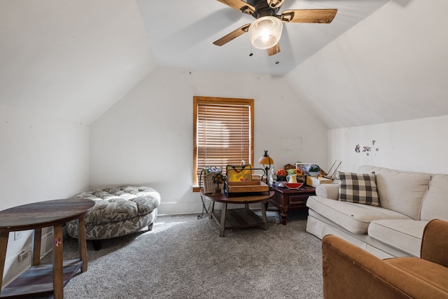 sitting room with a ceiling fan, vaulted ceiling, and carpet flooring