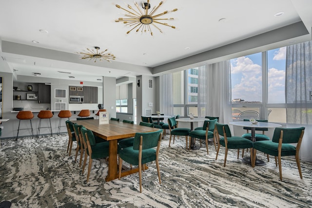 701 S Wells St Unit 3105, Chicago, IL 60607 - dining area featuring a chandelier