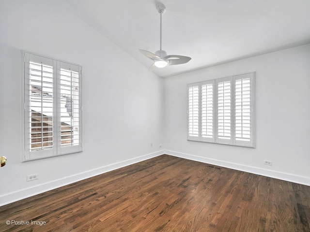 unfurnished room featuring visible vents, baseboards, a ceiling fan, wood finished floors, and vaulted ceiling