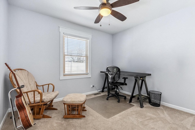 office featuring baseboards, a ceiling fan, and light colored carpet