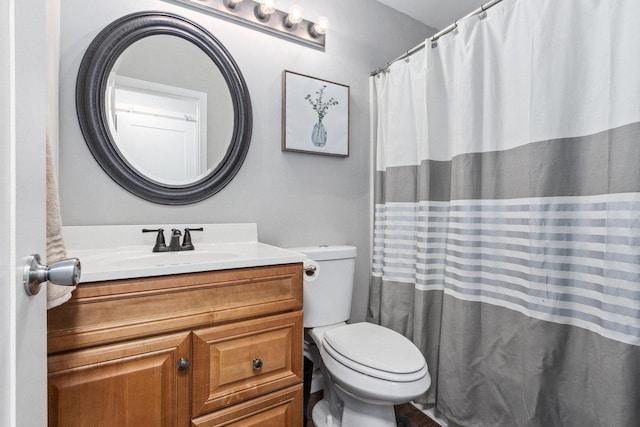 full bath featuring curtained shower, vanity, and toilet