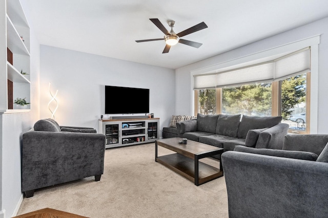 living room featuring light colored carpet and ceiling fan