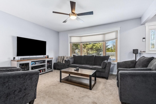 living room featuring light colored carpet and ceiling fan