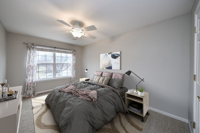 bedroom featuring carpet floors, baseboards, and a ceiling fan