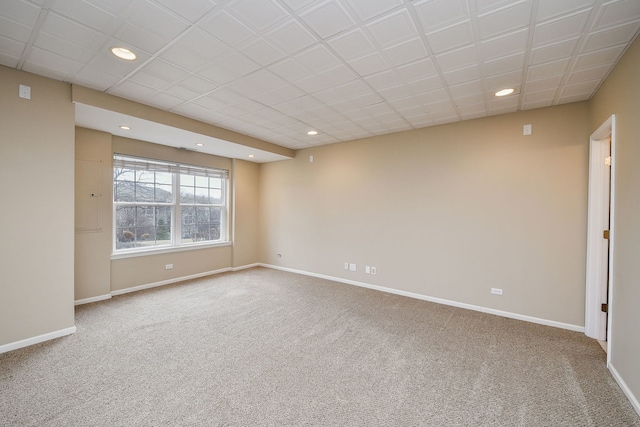 unfurnished room with recessed lighting, carpet, and baseboards