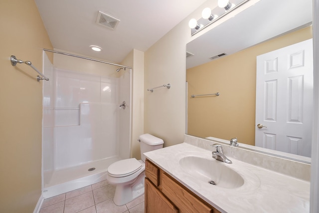 full bathroom with toilet, vanity, visible vents, a shower, and tile patterned floors