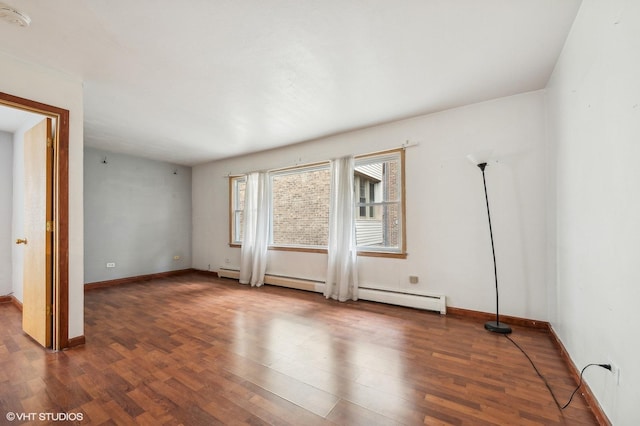 empty room featuring baseboards and dark wood-style flooring