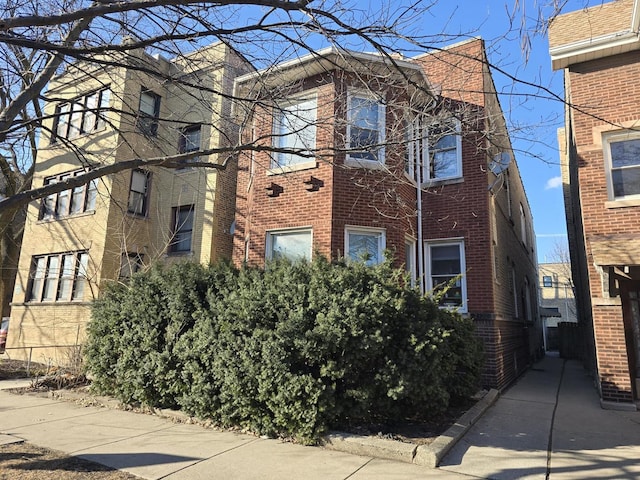 view of front of house featuring brick siding