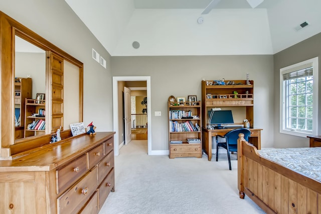 bedroom featuring light carpet and vaulted ceiling