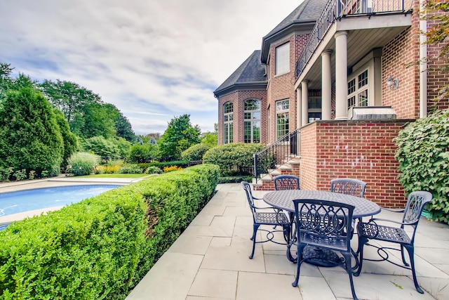 view of patio / terrace with a balcony