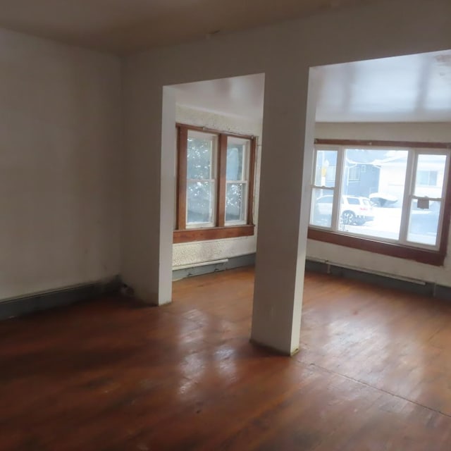 unfurnished room featuring dark hardwood / wood-style flooring