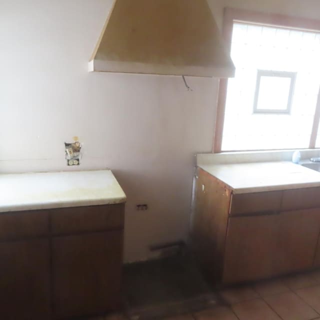 bathroom with tile patterned floors