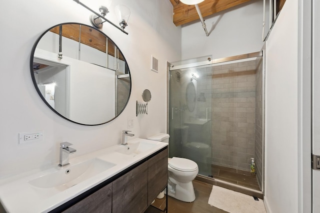 full bath with a stall shower, a sink, and visible vents