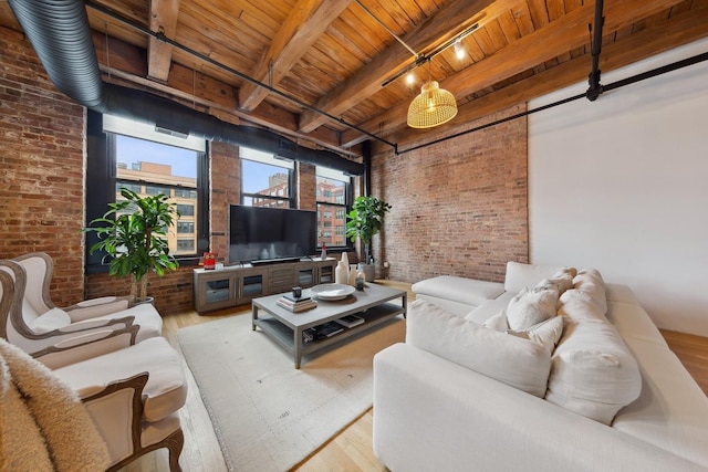 living area featuring wood ceiling, beamed ceiling, brick wall, and wood finished floors