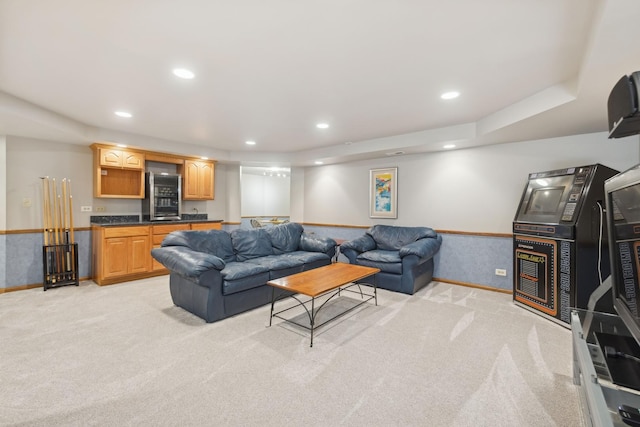 living room with recessed lighting and light colored carpet